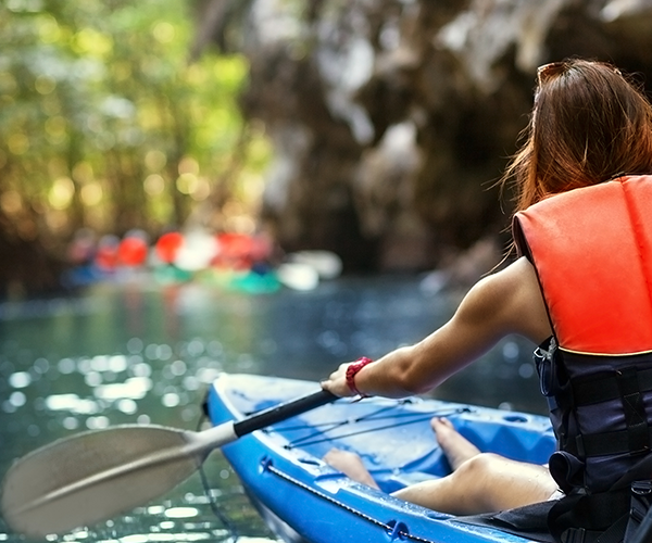 kayaker using a sit-on top kayak kayaker using a sit-on top kayak