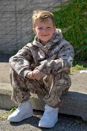 <div class="powerflex-label-boys">
Boys' <span class="powerflex-arrow-boys">›</span>
</div>
<style>
.powerflex-label-boys {
text-align: center;
background: #766A7E;
color: #ffffff;
font-weight: 700;
font-size: 16px;
padding: 12px 14px;
margin-top: 0;
cursor: pointer;
border-bottom: 4px solid #302E2D;
transition: all .2s ease;
}
.powerflex-label-boys:hover {
filter: brightness(90%);
}
.powerflex-arrow-boys {
display: inline-block;
margin-left: 7px;
font-size: 20px;
line-height: 1;
transition: transform .2s ease;
}
.powerflex-label-boys:hover .powerflex-arrow-boys {
transform: translateX(4px);
}
</style>